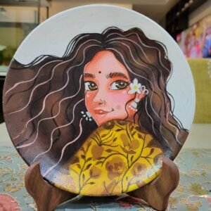 Hand-painted terracotta plate featuring a graceful feminine portrait with flowing textured hair, expressive eyes, and delicate floral detailing.